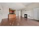 Open-concept living space with a fireplace, hardwood floors, and a kitchen area, ideal for entertaining at 390 Lake Placid Ct # 304, Altamonte Springs, FL 32701