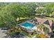 Community pool with a hot tub and lush landscaping creates a resort-like experience at 390 Lake Placid Ct # 304, Altamonte Springs, FL 32701