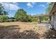 Spacious backyard with a covered patio and mature trees at 4124 Caywood Cir, Orlando, FL 32810