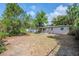 Expansive backyard featuring covered patios and mature trees at 4124 Caywood Cir, Orlando, FL 32810