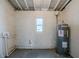 Unfinished basement features a water heater and a small window at 4124 Caywood Cir, Orlando, FL 32810