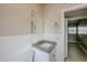Bathroom featuring granite vanity top, tiled backsplash, mirror and great light ready for your personal touch at 4124 Caywood Cir, Orlando, FL 32810