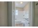 Bathroom featuring a shower-tub combo, tiled walls, granite vanity top, and tiled flooring at 4124 Caywood Cir, Orlando, FL 32810