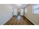 Bedroom with modern vinyl floors and neutral walls with a view to the bathroom at 4124 Caywood Cir, Orlando, FL 32810