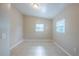 Neutral bedroom offers tile floors, recessed lighting, and a comfortable space to relax and unwind at 4124 Caywood Cir, Orlando, FL 32810