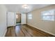 Bedroom with modern vinyl floors and neutral walls with a view to the bathroom at 4124 Caywood Cir, Orlando, FL 32810