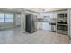 Bright kitchen featuring stainless steel appliances, white cabinets, and granite countertops at 4124 Caywood Cir, Orlando, FL 32810