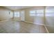 Spacious living room featuring neutral walls, tile flooring, and natural light at 4124 Caywood Cir, Orlando, FL 32810