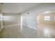 Open concept living room featuring neutral walls, tiled flooring, and plenty of natural light at 4124 Caywood Cir, Orlando, FL 32810