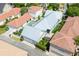 Aerial view of a modern home showcasing its roof, pool, and outdoor living spaces at 4148 Oak St, Orlando, FL 32814