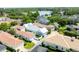 Gorgeous aerial view of a neighborhood featuring manicured lawns and a lake view in the background at 4148 Oak St, Orlando, FL 32814