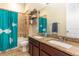Bathroom featuring granite countertops, double sinks, and shower-tub with fish curtain at 4148 Oak St, Orlando, FL 32814