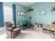 Brightly colored Bedroom featuring a crib, chair and shelving with toys at 4148 Oak St, Orlando, FL 32814