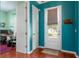 Bright entryway featuring a view to the office, a back door, and hardwood floors, creating a welcoming space at 4148 Oak St, Orlando, FL 32814
