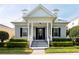 Charming home featuring a cozy porch, dormer windows, and neatly manicured landscaping, offering great curb appeal at 4148 Oak St, Orlando, FL 32814