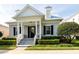 Inviting home exterior featuring a covered porch, dormer windows, neat landscaping, and a welcoming entrance at 4148 Oak St, Orlando, FL 32814