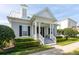 Beautiful home featuring dormer windows, a covered porch, and well-maintained landscaping, showcasing its appeal at 4148 Oak St, Orlando, FL 32814