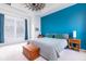 Bright bedroom featuring a large bed, accent wall, and modern decor, creating a comfortable retreat at 4148 Oak St, Orlando, FL 32814
