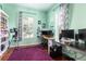 A large office with hardwood floors, natural lighting, and ample space for working at home at 4148 Oak St, Orlando, FL 32814