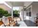 Covered porch featuring rocking chairs with backyard view at 4148 Oak St, Orlando, FL 32814