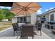 Relax on the outdoor patio with table and chairs perfect for enjoying meals and overlooking the backyard at 424 Eden Park Rd, Altamonte Springs, FL 32714