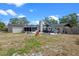 Large backyard featuring a patio and play area, ideal for outdoor relaxation and Gathering activities at 424 Eden Park Rd, Altamonte Springs, FL 32714