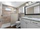 Elegant bathroom showcasing a glass-enclosed shower and a vanity with granite countertop at 424 Eden Park Rd, Altamonte Springs, FL 32714