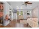 Bedroom boasts wood floors, closet, dresser, and a doorway to an attached bathroom at 424 Eden Park Rd, Altamonte Springs, FL 32714