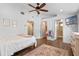 Bedroom features en-suite bathroom, walk-in closet, and modern ceiling fan at 424 Eden Park Rd, Altamonte Springs, FL 32714