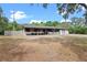 Charming exterior of home features a covered porch and a two-car garage at 424 Eden Park Rd, Altamonte Springs, FL 32714