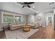 Inviting living room with wood-look flooring, neutral paint, and a ceiling fan at 424 Eden Park Rd, Altamonte Springs, FL 32714