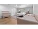 Bright main bedroom featuring a crib, daybed, and decorative accent wall at 424 Eden Park Rd, Altamonte Springs, FL 32714