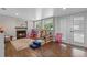 Bright playroom with lots of light, a decorative fireplace and access to the exterior at 424 Eden Park Rd, Altamonte Springs, FL 32714