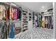 Spacious walk-in closet with custom shelving and storage solutions, plus geometric tile floors at 424 Eden Park Rd, Altamonte Springs, FL 32714