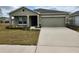 Charming single-Gathering home with a well-maintained lawn and a two-car garage at 4557 Ranunculus St, Haines City, FL 33844