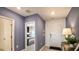 Open foyer with views into a bedroom, complemented by tile floors and natural light at 4557 Ranunculus St, Haines City, FL 33844