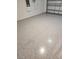 Epoxy-coated garage floor, providing a durable and aesthetically pleasing surface at 4557 Ranunculus St, Haines City, FL 33844
