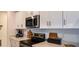 Modern kitchen with stainless steel appliances, white cabinetry, and quartz countertops at 4557 Ranunculus St, Haines City, FL 33844