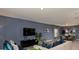 Comfortable living room with a modern sofa, TV, and elegant decor accents at 4557 Ranunculus St, Haines City, FL 33844