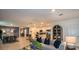 Spacious open-concept living area flowing into the kitchen, featuring stylish furnishings and decor at 4557 Ranunculus St, Haines City, FL 33844