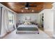 Spacious bedroom features a wooden ceiling, ceiling fan and light colored flooring at 51 Spruce Ln, Debary, FL 32713