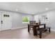 Bright dining room featuring a wooden table and bench, perfect for Gathering gatherings and entertaining at 51 Spruce Ln, Debary, FL 32713