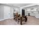 Cozy dining area with a wooden table, bench seating, and a bright window at 51 Spruce Ln, Debary, FL 32713