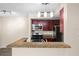 Modern kitchen featuring granite countertops, stainless steel appliances, and a breakfast bar at 5112 Conroy Rd # 13, Orlando, FL 32811