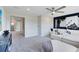 Open-concept living room with comfortable seating, custom wall, and plenty of natural light at 5262 Foothills Preserve Loop, Mount Dora, FL 32757