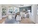 Comfortable living room showcasing an open floor plan, stylish decor, and access to multiple living spaces at 5262 Foothills Preserve Loop, Mount Dora, FL 32757