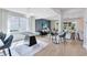 Spacious living area with a foosball table, stylish seating, and large windows, perfect for entertaining and relaxing at 5262 Foothills Preserve Loop, Mount Dora, FL 32757