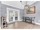 Cozy dining room with a table, chairs, and natural light from French doors at 5904 Lakewood Ln, Lakeland, FL 33805