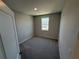 Bedroom with neutral paint and a window at 652 Pothos St, Apopka, FL 32703