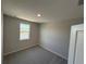 Bedroom with neutral paint and a window at 652 Pothos St, Apopka, FL 32703